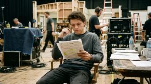 Tom Holland net worth candid rehearsal photo on movie set